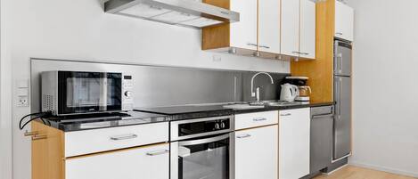 Fridge, stovetop, dishwasher, coffee/tea maker