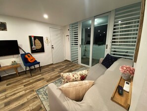 Comfort Apartment, Balcony, City View | Living area | Flat-screen TV - Castillo del Parque Stylish 2bed Apt (San Juan)