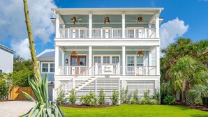 A two-story house with a balcony, a sign reading "Ocean Thriller," and a number "903" on the front. - Beach Access Directly Across Street! Ocean view, Private Pool, Hot Tub, Luxe New Construction (Isle Of Palms)