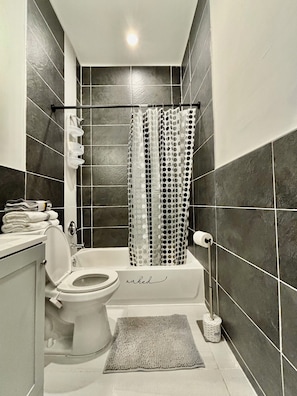 Hair dryer, towels, soap, shampoo