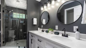 Shower, hair dryer, towels, toilet paper
