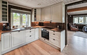 Fridge, dishwasher, coffee/tea maker, cookware/dishes/utensils