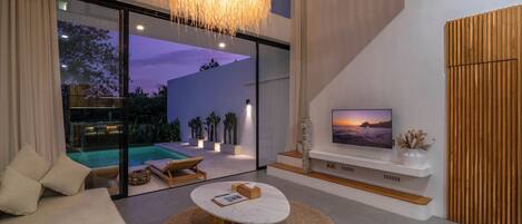 Villa Deluxe, 1 camera da letto, vista piscina | Area soggiorno | TV a schermo piatto