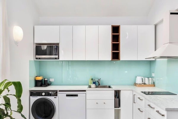 Full kitchen with generous utensil and products setup