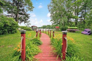 Property grounds - Cozy lake front cottage in Baldwin, MI with hot tub! (Baldwin)
