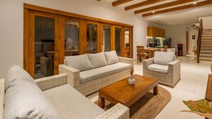 A spacious living area with a sofa, armchairs, and a coffee table. - Peaceful 3BR Villa Located in Pecatu - 10 Min to the Beach (Pecatu)