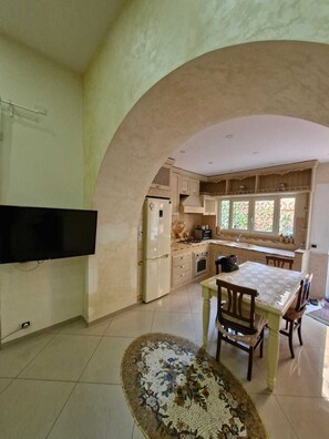 Fridge, microwave, toaster, dining tables