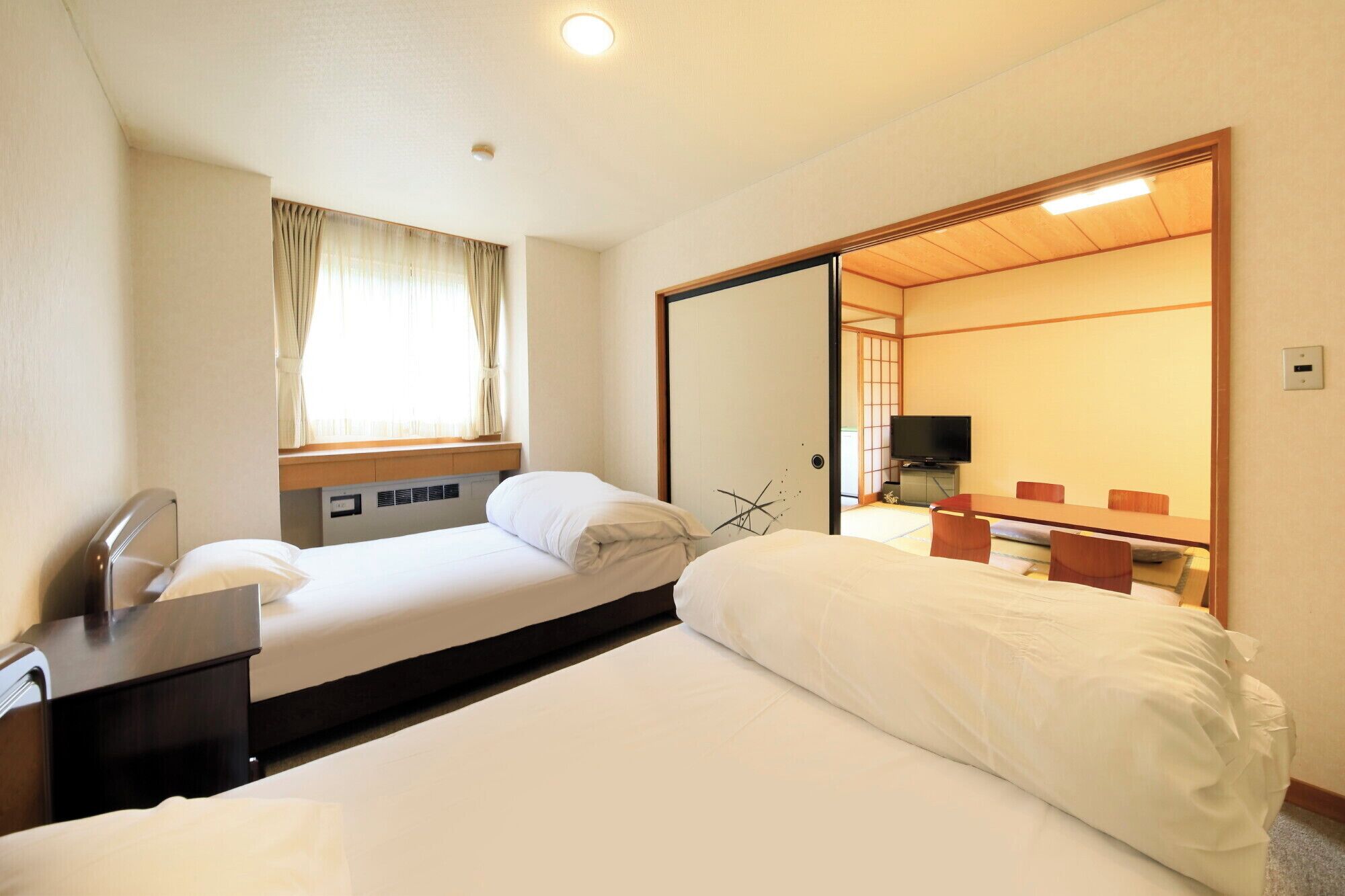 Japanese/Western-style: 10Tatami-mats + Twin Room + Separate Sitting Area (Non-smoking, with shower) | Free WiFi, bed sheets