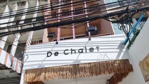 A building with a sign reading "De Chalet". - De Chalet (Bangkok)