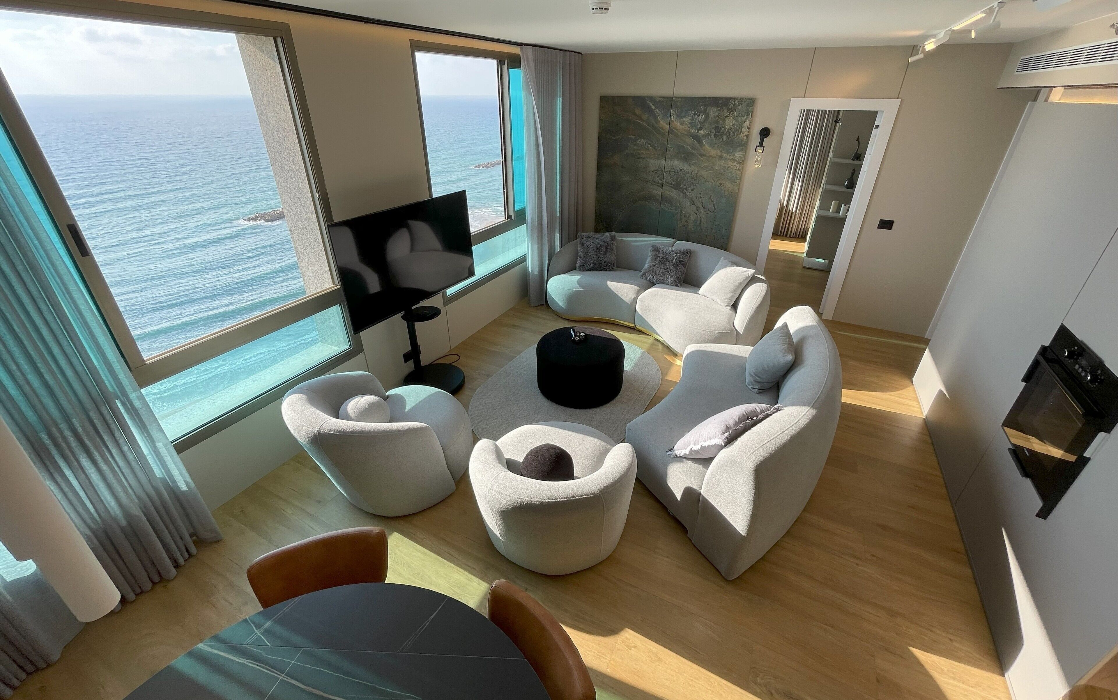 Luxury Apartment | Living area | 60-inch flat-screen TV with cable channels, pay movies