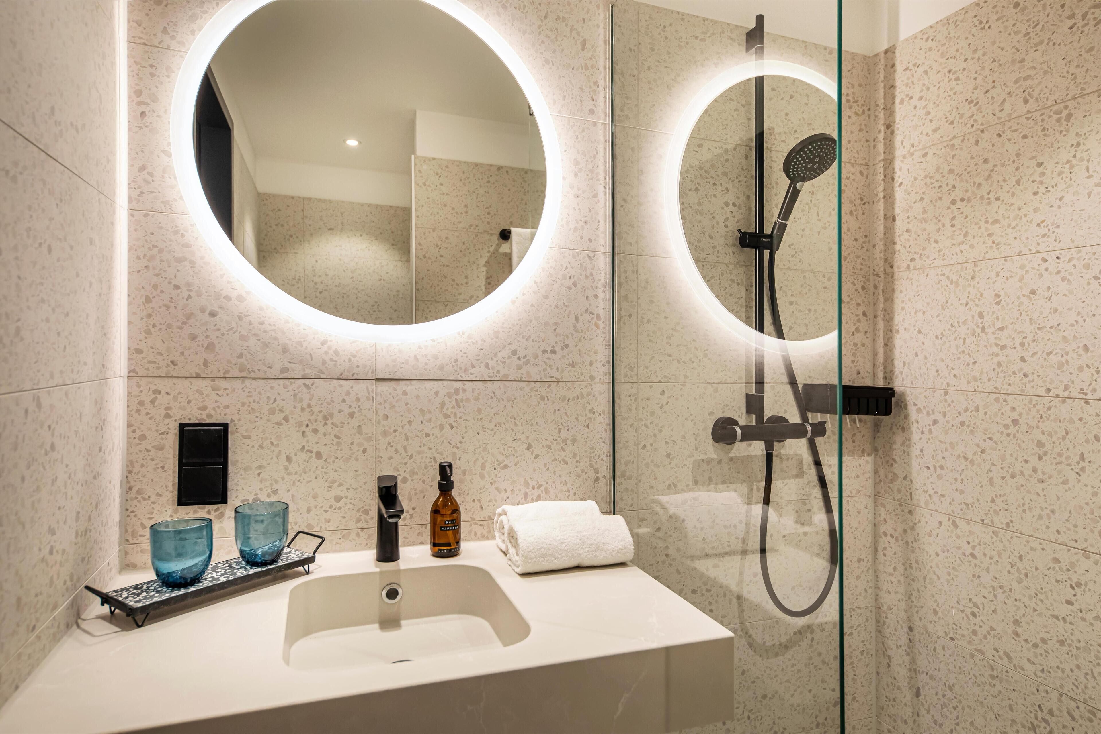Shower, hair dryer, towels, toilet paper