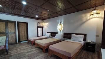 Standard Triple Room | 1 bedroom, in-room safe, desk, bed sheets