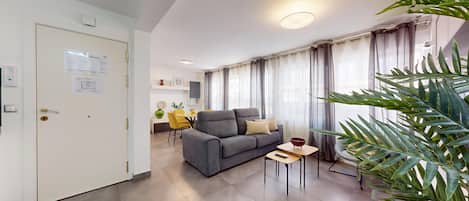 Deluxe Apartment | Living area | TV