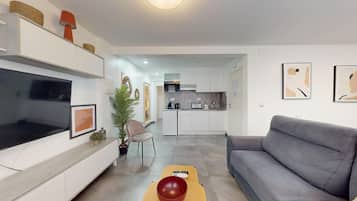 Appartement Deluxe | Coin séjour | Télévision