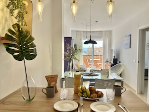 Enjoy a delicious breakfast in this stylish dining area with a city view.