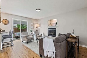 TV, fireplace, books, offices