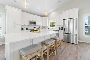 Fridge, microwave, oven, dishwasher - Experience relaxation at Coastal Chaos, a 3-bedroom home in Holden Beach. (Holden Beach)