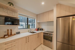 Coffee/tea maker, fridge, microwave, oven