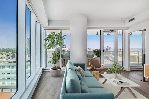 Panoramic, City View | Living area | 50-inch TV with cable channels