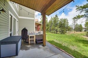 A covered patio with a barbecue grill, outdoor seating, and a storage shed. - Central Fraser Vacation Rental w/ Private Hot Tub! (Fraser)