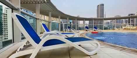Outdoor pool, open 10:00 AM to 6:00 PM, free cabanas, pool umbrellas