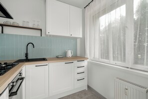 Apartment, 1 Bedroom, Balcony | Private kitchen | Microwave, oven, electric kettle, dining tables
