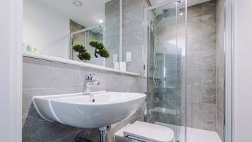 Apartment, 2 Bedrooms, Balcony, River View | Bathroom | Rainfall showerhead, free toiletries, hair dryer, towels