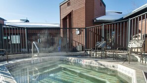 A hot tub area with a tiled edge, a metal railing, and a sign indicating a 3-foot depth. - Cozy Mountain Retreat at Timber Run 101! (Steamboat Springs)