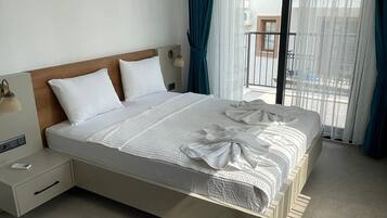 Premium bedding, desk, laptop workspace, iron/ironing board