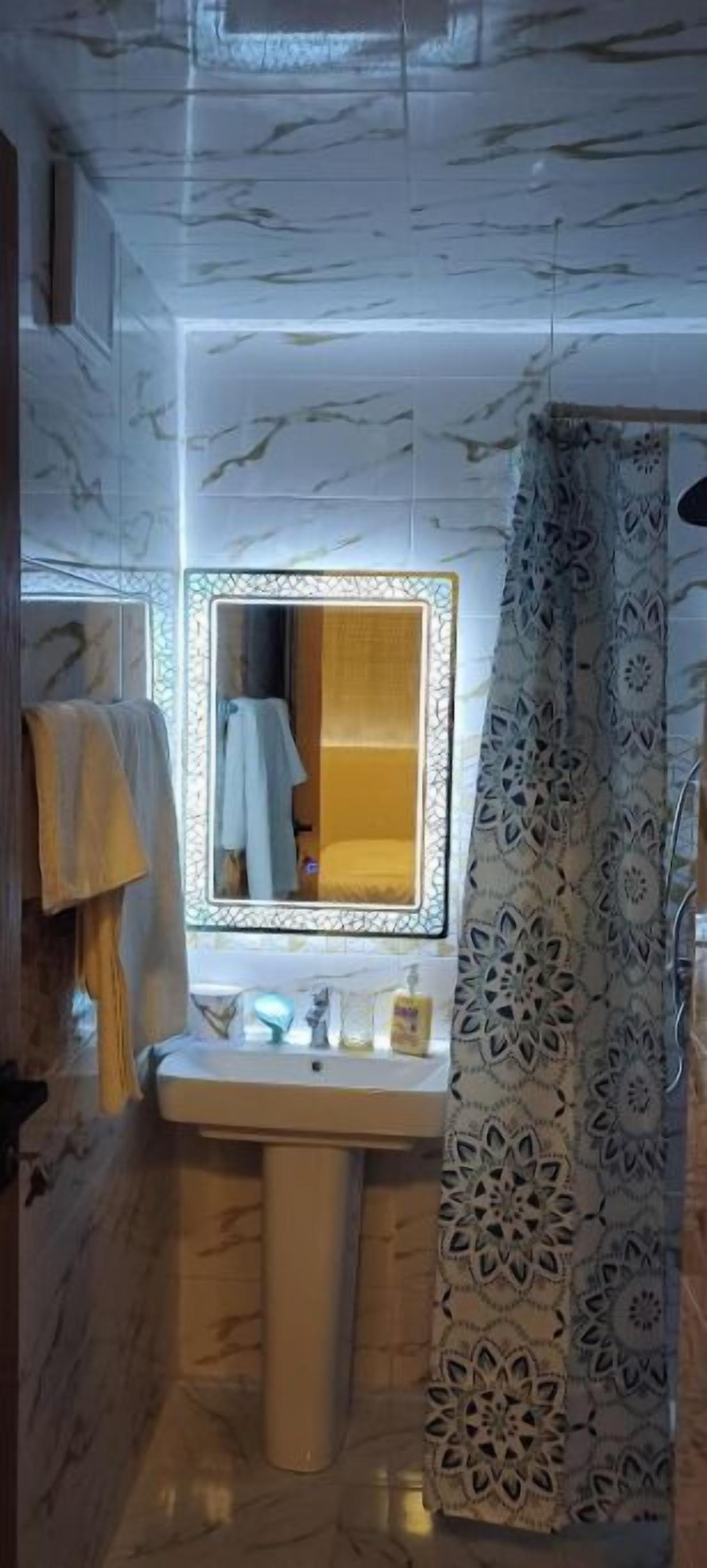 Shower, towels, soap, toilet paper