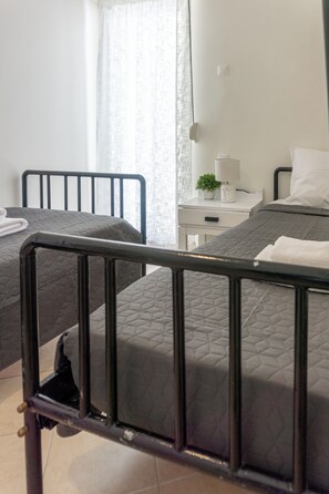 2 dormitorios, tabla de planchar con plancha, wifi gratis y ropa de cama