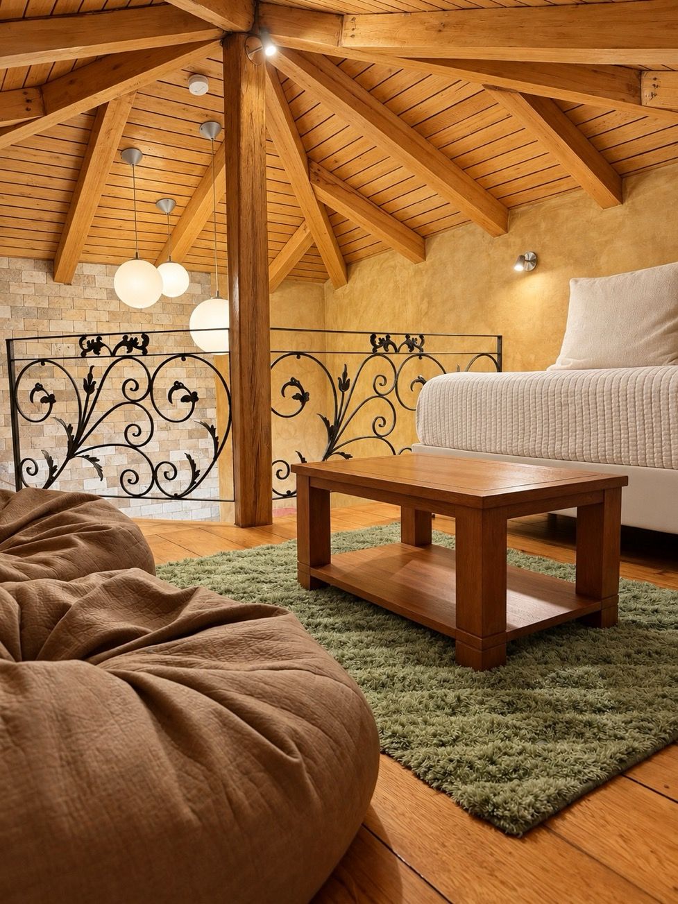 A cozy room with a wooden ceiling, a green rug, a wooden table, and a sofa.