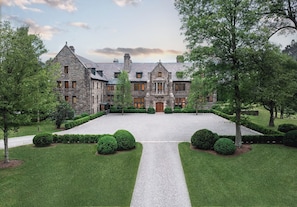 A large stone building with a symmetrical facade, multiple windows, and a central entrance. - The Ranch Hudson Valley (Sloatsburg)