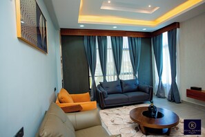 Appartement Luxe, 1 chambre, salle de bains privée | Coin séjour | Cheminée, chauffage par le sol