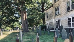 A cemetery with headstones and a wooden fence. - In home mini wing private space. 💜Stay at Hal's Salem, MA (Salem)