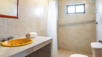 Economy House | Bathroom | Shower, towels, soap, toilet paper