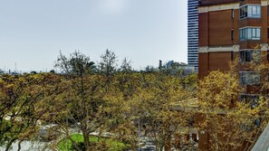 A multi-story building with a brick facade and large windows.