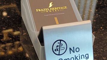 A box with a "No Smoking" sign in front of it.