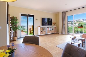 Enjoy the city view from the balcony through the large sliding glass door.