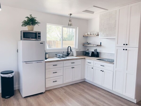 Fridge, microwave, stovetop, coffee/tea maker