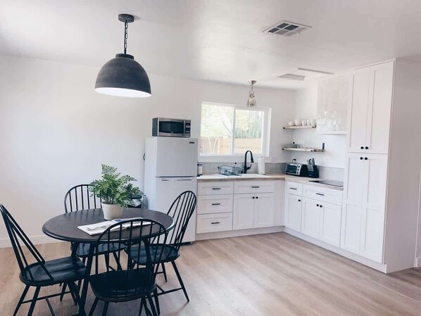 Fridge, microwave, stovetop, coffee/tea maker