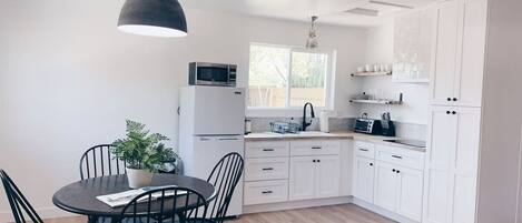 Fridge, microwave, stovetop, coffee/tea maker