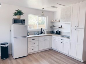 Fridge, microwave, stovetop, coffee/tea maker