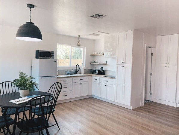 Fridge, microwave, stovetop, coffee/tea maker