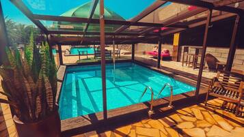 7 outdoor pools, open 10:00 AM to 10:00 PM, pool umbrellas, sun loungers
