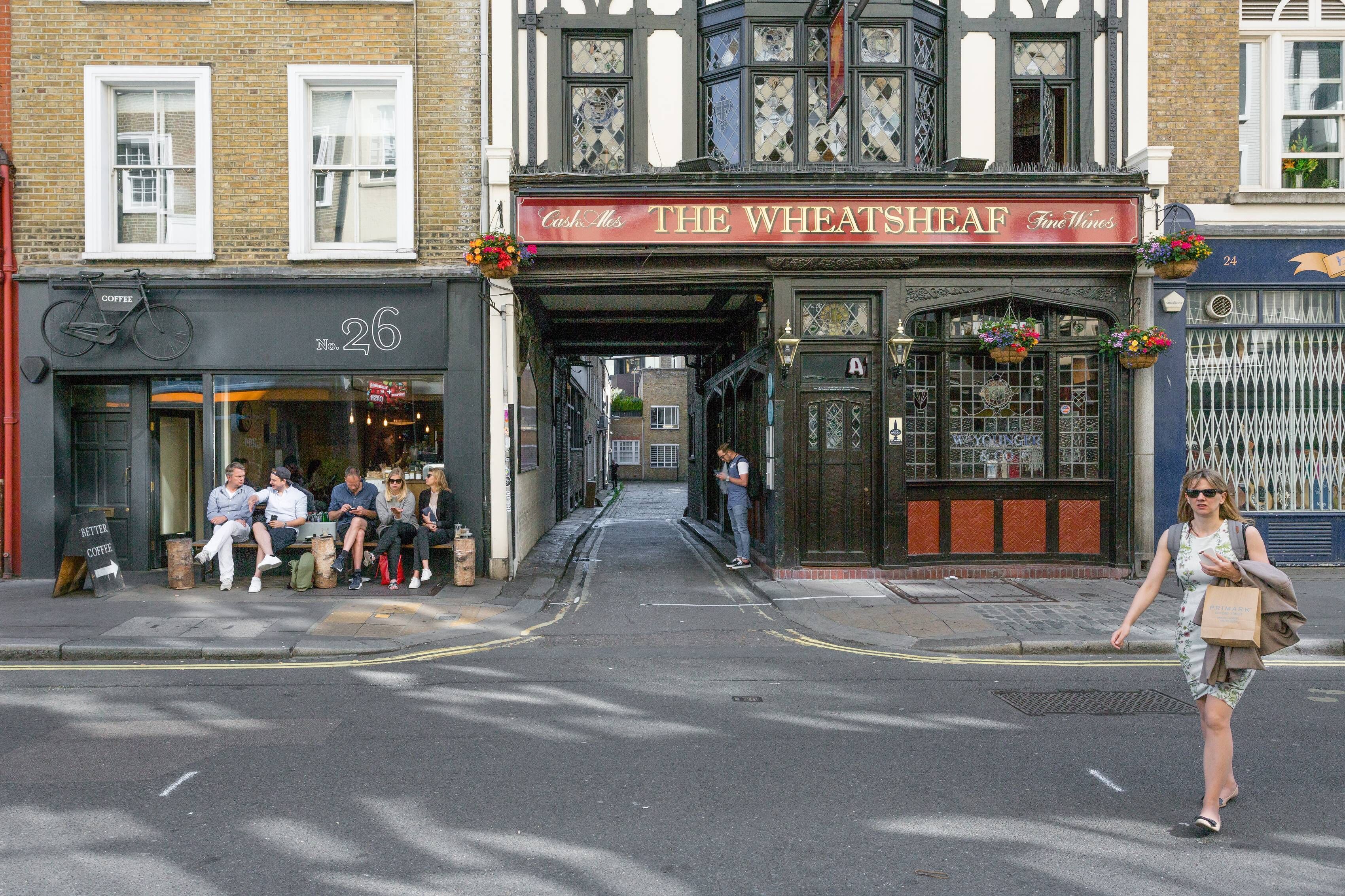 A street with a building labeled "The Wheatsheaf Fine Wines".