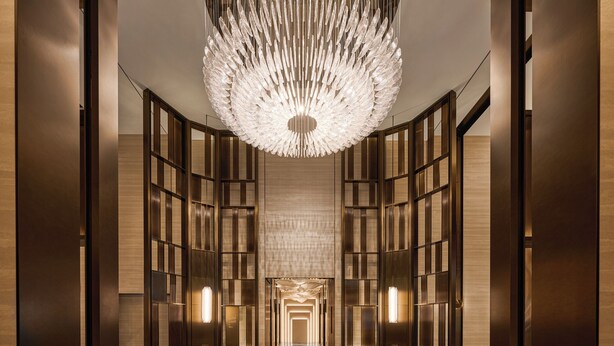 A modern interior with a central light fixture, mirrored walls, and a geometric floor pattern. - Intercontinental Taichung by IHG (Taichung)