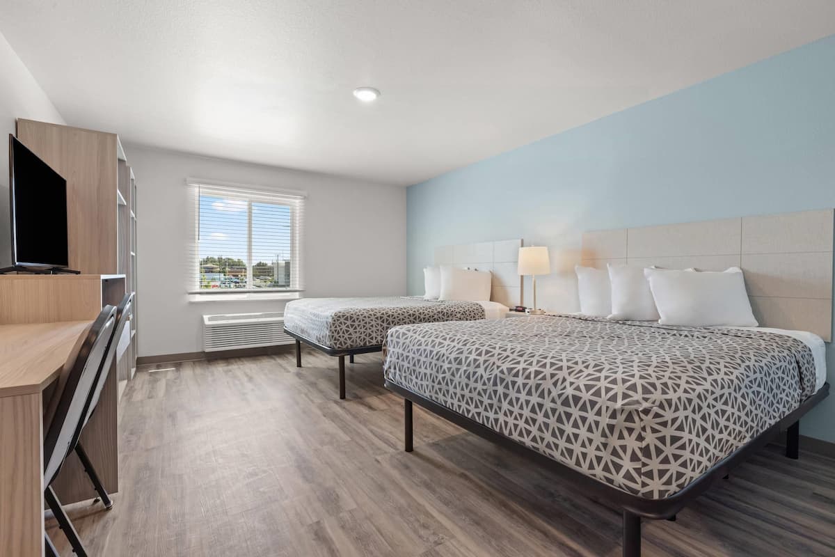 Suite, 2 Queen Beds, Non Smoking | Desk, laptop workspace, free WiFi, bed sheets