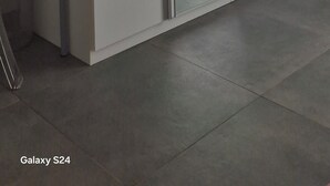 A modern wardrobe with sliding doors and a small table beside it. - B & B Malì (Salerno)