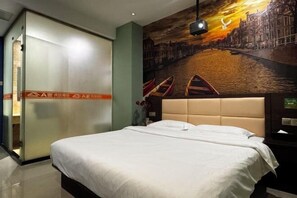 A hotel room with a large bed, a cityscape mural on the wall, a sliding door, and a nightstand with a lamp. - Ajia Chain Hotel Nanping Jiufeng (Nanping)